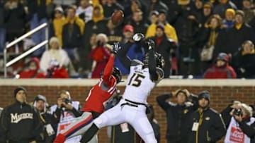 Nov 23, 2013; Oxford, MS, USA; Missouri Tigers wide receiver Dorial Green-Beckham (15) goes up for a pass against Mississippi Rebels defensive back Derrick Jones (19) at Vaught-Hemingway Stadium. Missouri Tigers defeat the Mississippi Rebels 24-10. Mandatory Credit: Spruce Derden-USA TODAY Sports