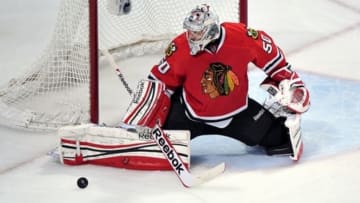 Jun 8, 2013; Chicago, IL, USA; Chicago Blackhawks goalie Corey Crawford (50) makes a save against the Los Angeles Kings during the first overtime in game five of the Western Conference finals of the 2013 Stanley Cup Playoffs at the United Center. Mandatory Credit: Scott Stewart-USA TODAY Sports