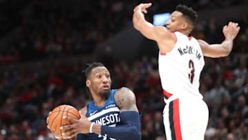 PORTLAND, OREGON - DECEMBER 21: Robert Covington #33 of the Minnesota Timberwolves works towards the basket against CJ McCollum #3 of the Portland Trail Blazers. Photo by Abbie Parr/Getty Images) (Photo by Abbie Parr/Getty Images)