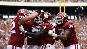 DALLAS, TX - OCTOBER 06: Trey Sermon #4 of the Oklahoma Sooners celebrates a touchdown against the Texas Longhorns in the fourth quarter of the 2018 AT&T Red River Showdown at Cotton Bowl on October 6, 2018 in Dallas, Texas. (Photo by Ronald Martinez/Getty Images)