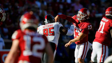 Former OU quarterback and Auburn football transfer portal target Caleb Williams (13) throws a pass while under pressure during a 52-21 win against Texas Tech on Oct. 30 in Norman.