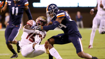 CHARLOTTESVILLE, VA - SEPTEMBER 14: Bryce Hall #34 of the Virginia Cavaliers breaks up a pass intended for Tamorrion Terry #15 of the Florida State Seminoles in the first half during a game at Scott Stadium on September 14, 2019 in Charlottesville, Virginia. (Photo by Ryan M. Kelly/Getty Images)