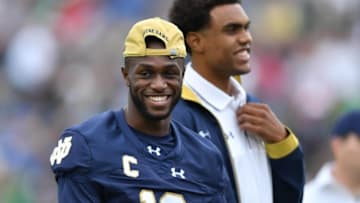 Sep 10, 2016; South Bend, IN, USA; Notre Dame Fighting Irish wide receiver Torii Hunter Jr. (16) and student coach Corey Robinson laugh during warmups before the game against the Nevada Wolf Pack at Notre Dame Stadium. Notre Dame won 39-10. Mandatory Credit: Matt Cashore-USA TODAY Sports