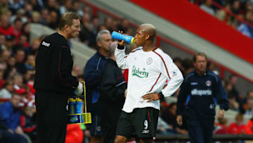 LONDON - SEPTEMBER 28: El Hadji Diouf of Liverpool enjoys a drink of Lucozade Sport during the FA Barclaycard Premiership match between Charlton Athletic and Liverpool held on September 28, 2003 at The Valley, in London. Charlton Athletic won the match 3-2. (Photo by Jamie McDonald/Getty Images)