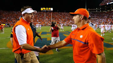 AUBURN, AL - SEPTEMBER 03: Head coach Gus Malzahn of the Auburn Tigers (L) shakes hands with head coach Dabo Swinney of the Clemson Tigers after their game at Jordan Hare Stadium on September 3, 2016 in Auburn, Alabama. The Clemson Tigers defeated the Auburn Tigers 19-13. (Photo by Kevin C. Cox/Getty Images)