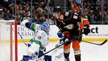 ANAHEIM, CALIFORNIA - NOVEMBER 01: Jacob Markstrom #25 of the Vancouver Canucks makes a save on Rickard Rakell #67 of the Anaheim Ducks during the third period in a 2-1 overtime Ducks win at Honda Center on November 01, 2019 in Anaheim, California. (Photo by Harry How/Getty Images)