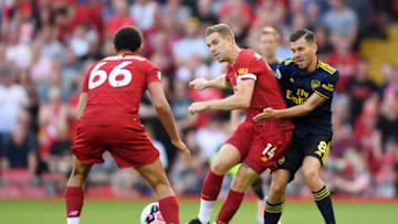 LIVERPOOL, ENGLAND - AUGUST 24: Dani Ceballos of Arsenal challenges Jordan Henderson of Liverpool during the Premier League match between Liverpool FC and Arsenal FC at Anfield on August 24, 2019 in Liverpool, United Kingdom. (Photo by Laurence Griffiths/Getty Images)