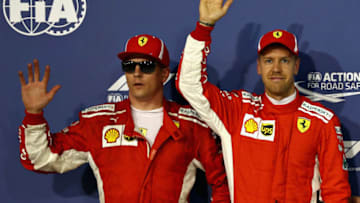 BAHRAIN, BAHRAIN - APRIL 07: Top two qualifiers Sebastian Vettel of Germany and Ferrari and Kimi Raikkonen of Finland and Ferrari in parc ferme during qualifying for the Bahrain Formula One Grand Prix at Bahrain International Circuit on April 7, 2018 in Bahrain, Bahrain. (Photo by Mark Thompson/Getty Images)