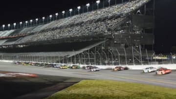 Jul 5, 2015; Daytona Beach, FL, USA; NASCAR Sprint Cup Series drivers race in front of the grand stands during the Coke Zero 400 at Daytona International Speedway. Mandatory Credit: Jasen Vinlove-USA TODAY Sports