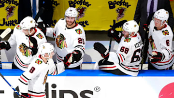 EDMONTON, ALBERTA - AUGUST 01: Dominik Kubalik #8 of the Chicago Blackhawks is congratulated by teammates on the bench after he scored in the second period against the Edmonton Oilers in Game One of the Eastern Conference Qualification Round prior to the 2020 NHL Stanley Cup Playoffs at Rogers Place on August 01, 2020 in Edmonton, Alberta. (Photo by Jeff Vinnick/Getty Images)