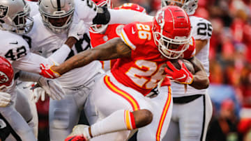 KANSAS CITY, MO - DECEMBER 30: Damien Williams #26 of the Kansas City Chiefs moves a pile of defenders in to the end zone for a touchdown during the first quarter of the game against the Oakland Raiders at Arrowhead Stadium on December 30, 2018 in Kansas City, Missouri. (Photo by David Eulitt/Getty Images)