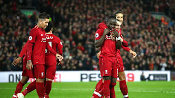 LIVERPOOL, ENGLAND - DECEMBER 29: Sadio Mane of Liverpool celebrates with team mates after scoring his sides third goal during the Premier League match between Liverpool FC and Arsenal FC at Anfield on December 29, 2018 in Liverpool, United Kingdom. (Photo by Clive Brunskill/Getty Images)