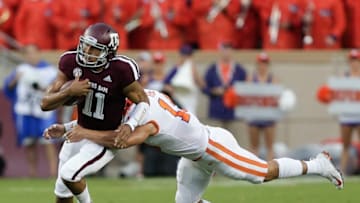COLLEGE STATION, TX - SEPTEMBER 08: Kellen Mond #11 of the Texas A&M Aggies is tackled by Tanner Muse #19 of the Clemson Tigers as he rushes in the first quarter at Kyle Field on September 8, 2018 in College Station, Texas. (Photo by Bob Levey/Getty Images)