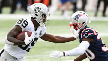 Sep 27, 2020; Foxborough, Massachusetts, USA; Las Vegas Raiders wide receiver Bryan Edwards (89) stiff arms New England Patriots cornerback Jason McCourty (30) during the third quarter at Gillette Stadium. Mandatory Credit: Brian Fluharty-USA TODAY Sports