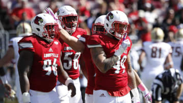 LOUISVILLE, KY - OCTOBER 14: James Hearns #99 of the Louisville Cardinals reacts after sacking Anthony Brown #13 of the Boston College Eagles in the second quarter of a game at Papa John's Cardinal Stadium on October 14, 2017 in Louisville, Kentucky. (Photo by Joe Robbins/Getty Images)