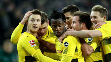MOENCHENGLADBACH, GERMANY - FEBRUARY 18: Marco Reus of Dortmund (L) celebrates the first goal with his team mates during to the Bundesliga match between Borussia Moenchengladbach and Borussia Dortmund at Borussia-Park on February 18, 2018 in Moenchengladbach, Germany. (Photo by Christof Koepsel/Bongarts/Getty Images)