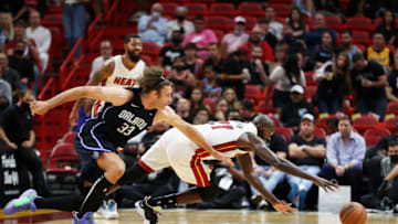 Dewayne Dedmon #21 of the Miami Heat and Robin Lopez #33 of the Orlando Magic vie for a loose ball(Photo by Cliff Hawkins/Getty Images)