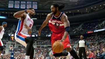 Oct 30, 2013; Auburn Hills, MI, USA; Washington Wizards center Nene (42) drives past Detroit Pistons center Greg Monroe (10) during the second quarter at The Palace of Auburn Hills. Mandatory Credit: Tim Fuller-USA TODAY Sports