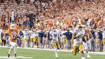 Sep 4, 2016; Austin, TX, USA; Notre Dame Fighting Irish cornerback Shaun Crawford (20) runs back a blocked extra point as Texas Longhorns kicker Trent Domingue (17) pursues in the fourth quarter at Darrell K. Royal-Texas Memorial Stadium. Notre Dame scored two points on the play to tied the game. Texas won 50-47 in double overtime. Mandatory Credit: Matt Cashore-USA TODAY Sports