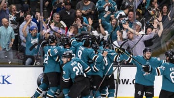 SAN JOSE, CA - APRIL 23: The San Jose Sharks team piles on San Jose Sharks right wing Barclay Goodrow (23) celebrating the win in Game 7, Round 1 between the Vegas Golden Knights and the San Jose Sharks on Tuesday, April 23, 2019 at the SAP Center, San Jose, CA. (Photo by Douglas Stringer/Icon Sportswire via Getty Images)
