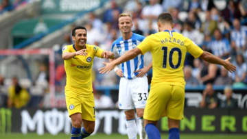 HUDDERSFIELD, ENGLAND - AUGUST 11: Pedro of Chelsea celebrates with teammate Eden Hazard after scoring his team's third goal during the Premier League match between Huddersfield Town and Chelsea FC at John Smith's Stadium on August 11, 2018 in Huddersfield, United Kingdom. (Photo by Shaun Botterill/Getty Images)