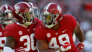 TUSCALOOSA, AL - NOVEMBER 10: Isaiah Buggs #49 of the Alabama Crimson Tide reacts with Mack Wilson #30 after a defensive stop against the Mississippi State Bulldogs at Bryant-Denny Stadium on November 10, 2018 in Tuscaloosa, Alabama. (Photo by Kevin C. Cox/Getty Images)