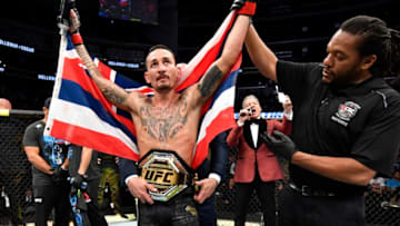 EDMONTON, ALBERTA - JULY 27: Max Holloway celebrates after defeating Frankie Edgar in their UFC featherweight championship bout during the UFC 240 event at Rogers Place on July 27, 2019 in Edmonton, Alberta, Canada. (Photo by Jeff Bottari/Zuffa LLC/Zuffa LLC)