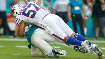 MIAMI, FL - DECEMBER 02: Lorenzo Alexander #57 of the Buffalo Bills sacks Ryan Tannehill #17 of the Miami Dolphins during the first half at Hard Rock Stadium on December 2, 2018 in Miami, Florida. (Photo by Michael Reaves/Getty Images)