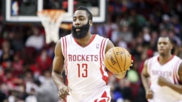 Jan 3, 2014; Houston, TX, USA; Houston Rockets shooting guard James Harden (13) brings the ball up the court during the first quarter against the New York Knicks at Toyota Center. Mandatory Credit: Troy Taormina-USA TODAY Sports