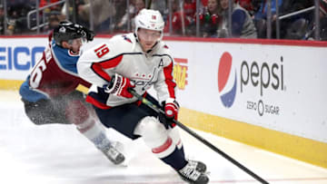DENVER, COLORADO - FEBRUARY 13: Nicklas Backstrom #19 of the Washington Capitals brings the puck off the boards against Mikko Rantanen #96 of the Colorado Avalanche in the second period at the Pepsi Center on February 13, 2020 in Denver, Colorado. (Photo by Matthew Stockman/Getty Images)