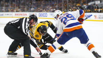 BOSTON, MA - JUNE 7: Linesman David Brisebois initiates a face-off between Patrice Bergeron #37 of the Boston Bruins and Brock Nelson #29 of the New York Islanders in Game Five of the Second Round of the 2021 Stanley Cup Playoffs at TD Garden on June 7, 2021 in Boston, Massachusetts. (Photo by Adam Glanzman/Getty Images)