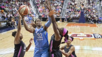 UNCASVILLE, CONNECTICUT- August 12: Cheyenne Parker #32 of the Chicago Sky drives to the basket defended by Betnijah Laney #44 of the Connecticut Sun and Chiney Ogwumike #13 of the Connecticut Sun during the Connecticut Sun Vs Chicago Sky, WNBA regular season game at Mohegan Sun Arena on August 12, 2018 in Uncasville, Connecticut. (Photo by Tim Clayton/Corbis via Getty Images)