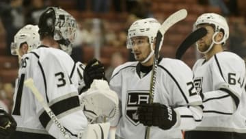 Sep 28, 2014; Anaheim, CA, USA; Los Angeles Kings goalie Martin Jones (31) celebrates with Los Angeles Kings defender Slava Voynov (26) after the game against the Los Angeles Kings at Honda Center. The Los Angeles Kings defeated the Anaheim Ducks with a final score of 4-2. Mandatory Credit: Kelvin Kuo-USA TODAY Sports
