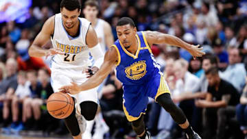 Oct 14, 2016; Denver, CO, USA; Golden State Warriors guard Phil Pressey (26) and Denver Nuggets guard Jamal Murray (27) battle for the ball in overtime at the Pepsi Center. The Warriors won 129-128. Mandatory Credit: Isaiah J. Downing-USA TODAY Sports