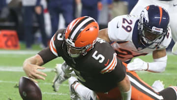 Cleveland Browns quarterback Case Keenum fumbles the ball near the goal line after taking a hit from DenverÕs Bryce Callahan on Thursday, Oct. 21, 2021 in Cleveland, at FirstEnergy Stadium. The Browns won the game 17-14. [Phil Masturzo/ Beacon Journal]Browns11