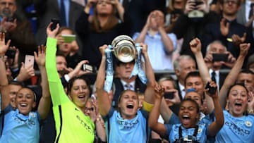 LONDON, ENGLAND - MAY 13: Steph Houghton of Manchester City lifts the trophy after the SSE Women's FA Cup Final between Birmingham City Ladies and Manchester City Women at Wembley Stadium on May 13, 2017 in London, England. (Photo by Ross Kinnaird/Getty Images)