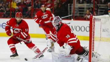 Oct 10, 2014; Raleigh, NC, USA; Carolina Hurricanes goalie Cam Ward (30) makes 3rd period save against the New York Islanders at PNC Arena. The New York Islanders defeated the Carolina Hurricanes 5-3. Mandatory Credit: James Guillory-USA TODAY Sports