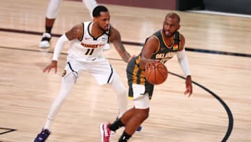 LAKE BUENA VISTA, FLORIDA - AUGUST 03: Chris Paul #3 of the Oklahoma City Thunder handles the ball against Monte Morris #11 of the Denver Nuggets in the first half at The Arena at ESPN Wide World Of Sports Complex on August 3, 2020 in Lake Buena Vista, Florida. NOTE TO USER: User expressly acknowledges and agrees that, by downloading and or using this photograph, User is consenting to the terms and conditions of the Getty Images License Agreement. (Photo by Kim Klement-Pool/Getty Images)