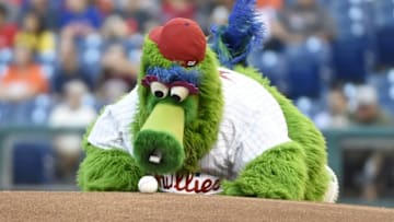 Aug 27, 2015; Philadelphia, PA, USA; Phillie Phanatic checks out the baseball before start of the game between New York Mets and Philadelphia Phillies at Citizens Bank Park. Mandatory Credit: Eric Hartline-USA TODAY Sports
