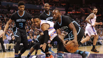Jan 4, 2017; Charlotte, NC, USA; Charlotte Hornets guard Kemba Walker (15) and Oklahoma Thunder guard Russell Westbrook (0) go after a loose ball during the first half at the Spectrum Center. Mandatory Credit: Sam Sharpe-USA TODAY Sports