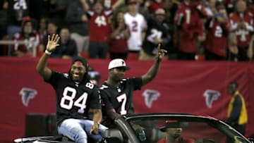 Jan 1, 2017; Atlanta, GA, USA; Former Atlanta Falcons wide receiver Roddy White and quarterback Michael Vick are honored during halftime of the Falcons game against the New Orleans Saints at the Georgia Dome. Mandatory Credit: Jason Getz-USA TODAY Sports