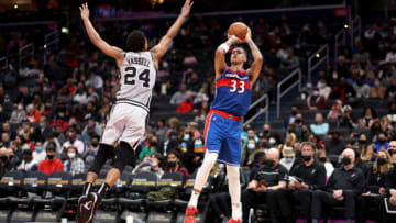WASHINGTON, DC - FEBRUARY 25: Kyle Kuzma #33 of the Washington Wizards shoots over Devin Vassell #24 of the San Antonio Spurs during the second quarter at Capital One Arena on February 25, 2022 in Washington, DC. NOTE TO USER: User expressly acknowledges and agrees that, by downloading and or using this photograph, User is consenting to the terms and conditions of the Getty Images License Agreement. (Photo by Rob Carr/Getty Images)