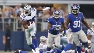 Oct 19, 2014; Arlington, TX, USA; Dallas Cowboys running back DeMarco Murray (29) runs with the ball against New York Giants safety Quintin Demps (35) at AT&T Stadium. Mandatory Credit: Matthew Emmons-USA TODAY Sports