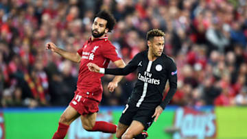 LIVERPOOL, ENGLAND - SEPTEMBER 18: Neymar of Paris Saint-Germain runs with the ball under pressure from Mohamed Salah of Liverpool during the Group C match of the UEFA Champions League between Liverpool and Paris Saint-Germain at Anfield on September 18, 2018 in Liverpool, United Kingdom. (Photo by Michael Regan/Getty Images)