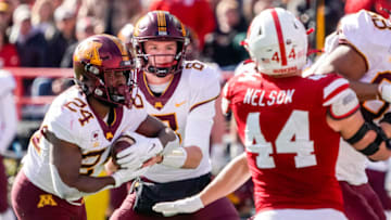 Minnesota Golden Gophers quarterback Athan Kaliakmanis (8) hands the ball off (Dylan Widger-USA TODAY Sports)