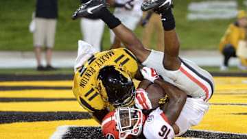 Sep 17, 2016; Columbia, MO, USA; Georgia Bulldogs wide receiver Isaiah McKenzie (16) catches a touchdown pass as Missouri Tigers defensive back Aarion Maxey-Penton (11) defends in the second half at Faurot Field. The Bulldogs won 28-27. Mandatory Credit: John Rieger-USA TODAY Sports