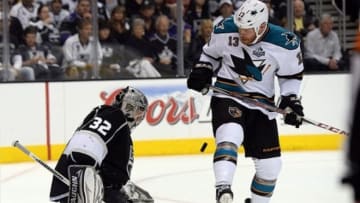 May 14, 2013; Los Angeles, CA, USA; Los Angeles Kings goalie Jonathan Quick (32) makes a save off San Jose Sharks left wing Raffi Torres (13) in the second period of game one of the second round of the 2013 Stanley Cup Playoffs at Staples Center. Mandatory Credit: Jayne Kamin-Oncea-USA TODAY Sports