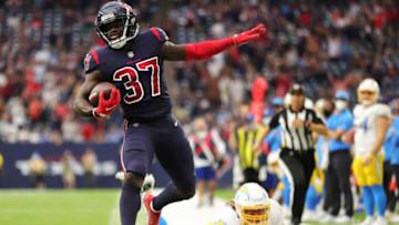 HOUSTON, TEXAS - DECEMBER 26: Tavierre Thomas #37 of the Houston Texans returns an interception for a touchdown during the fourth quarter against the Los Angeles Chargers at NRG Stadium on December 26, 2021 in Houston, Texas. (Photo by Carmen Mandato/Getty Images)