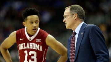 KANSAS CITY, MO - MARCH 08: Head coach Lon Kruger of the Oklahoma Sooners talks with Jordan Shepherd
