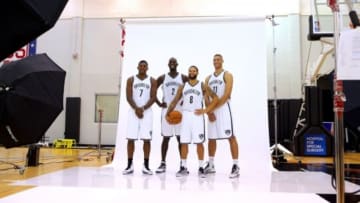 Sep 26, 2014; East Rutherford, NJ, USA; Brooklyn Nets shooting guard Joe Johnson (7) and center Kevin Garnett (2) and point guard Deron Williams (8) and center Brook Lopez (11) pose for a photo during media day at the Brooklyn Nets Practice Facility. Mandatory Credit: Brad Penner-USA TODAY Sports